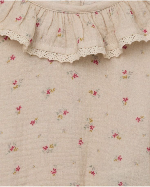 Body beige con olan y flores
