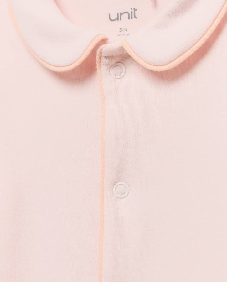Mameluco rosa palo Unit - detalle cuello y ribete melocotón