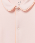 Mameluco rosa palo Unit - detalle cuello y ribete melocotón